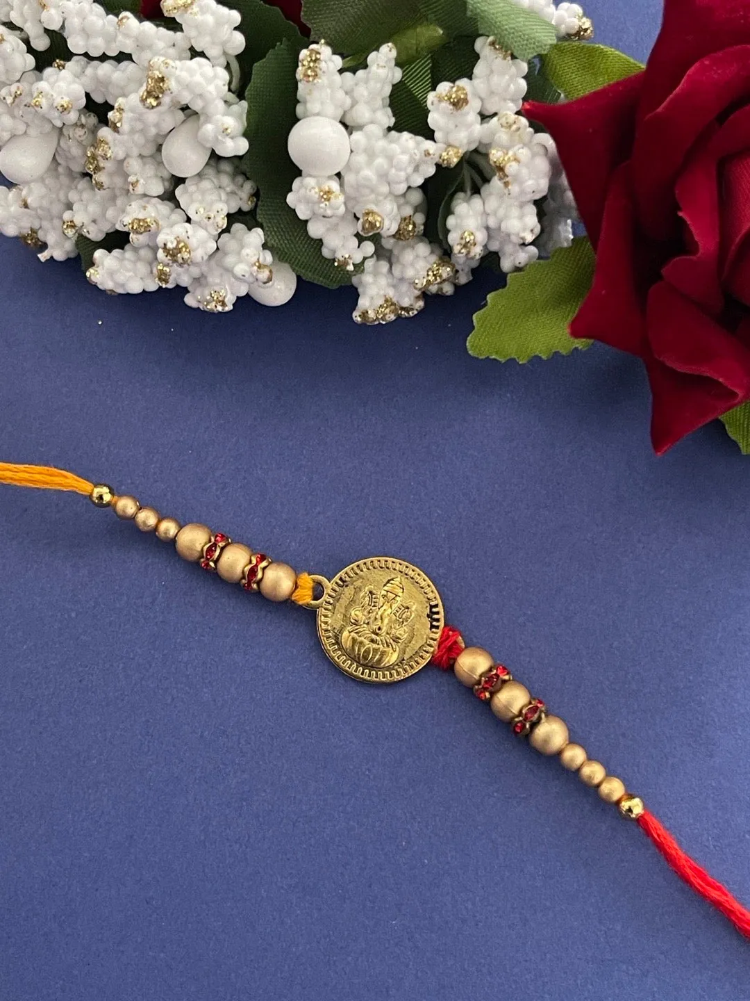 Fancy Rakhi Designs Ganesh Ji Pendant Cream Color Beads Multicoloured Mauli Thread Raksha Bandhan