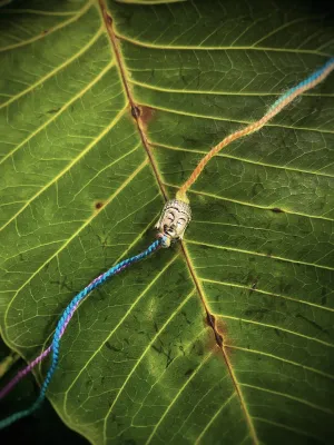 Simple German Silver Oxidised Buddha On Multicolored Thread Rakhi For Raksha Bandhan
