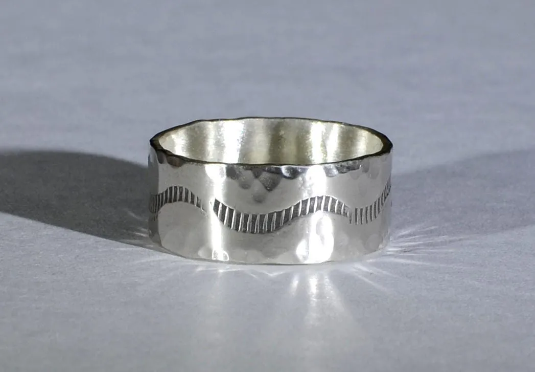 Sterling silver ring with rustic hammered finish and wave design