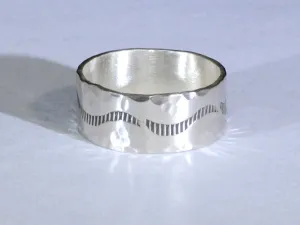 Sterling silver ring with rustic hammered finish and wave design