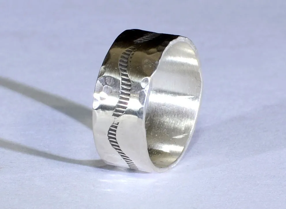 Sterling silver ring with rustic hammered finish and wave design