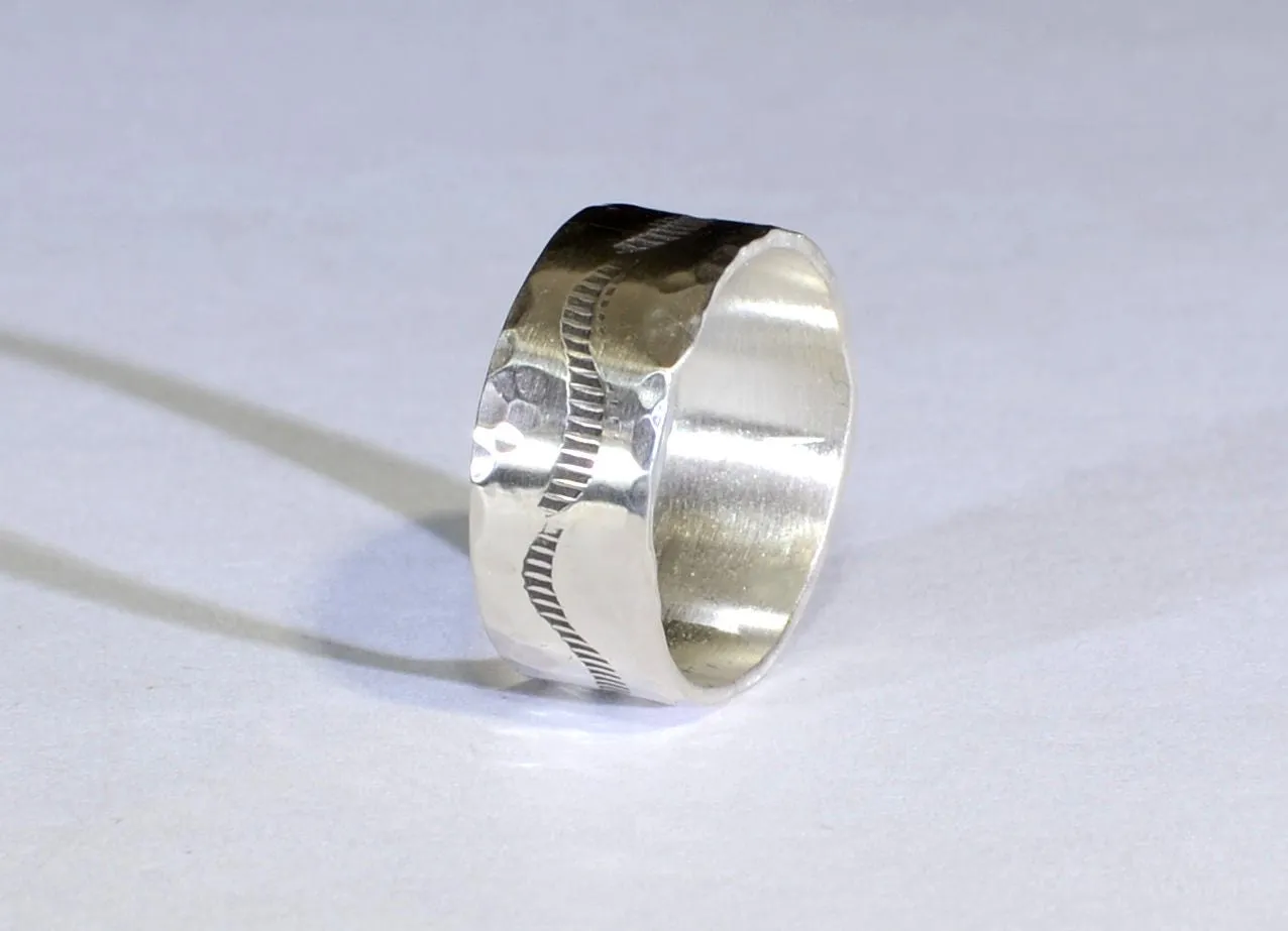 Sterling silver ring with rustic hammered finish and wave design