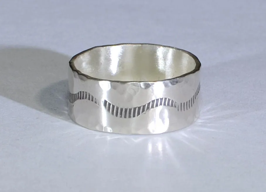 Sterling silver ring with rustic hammered finish and wave design